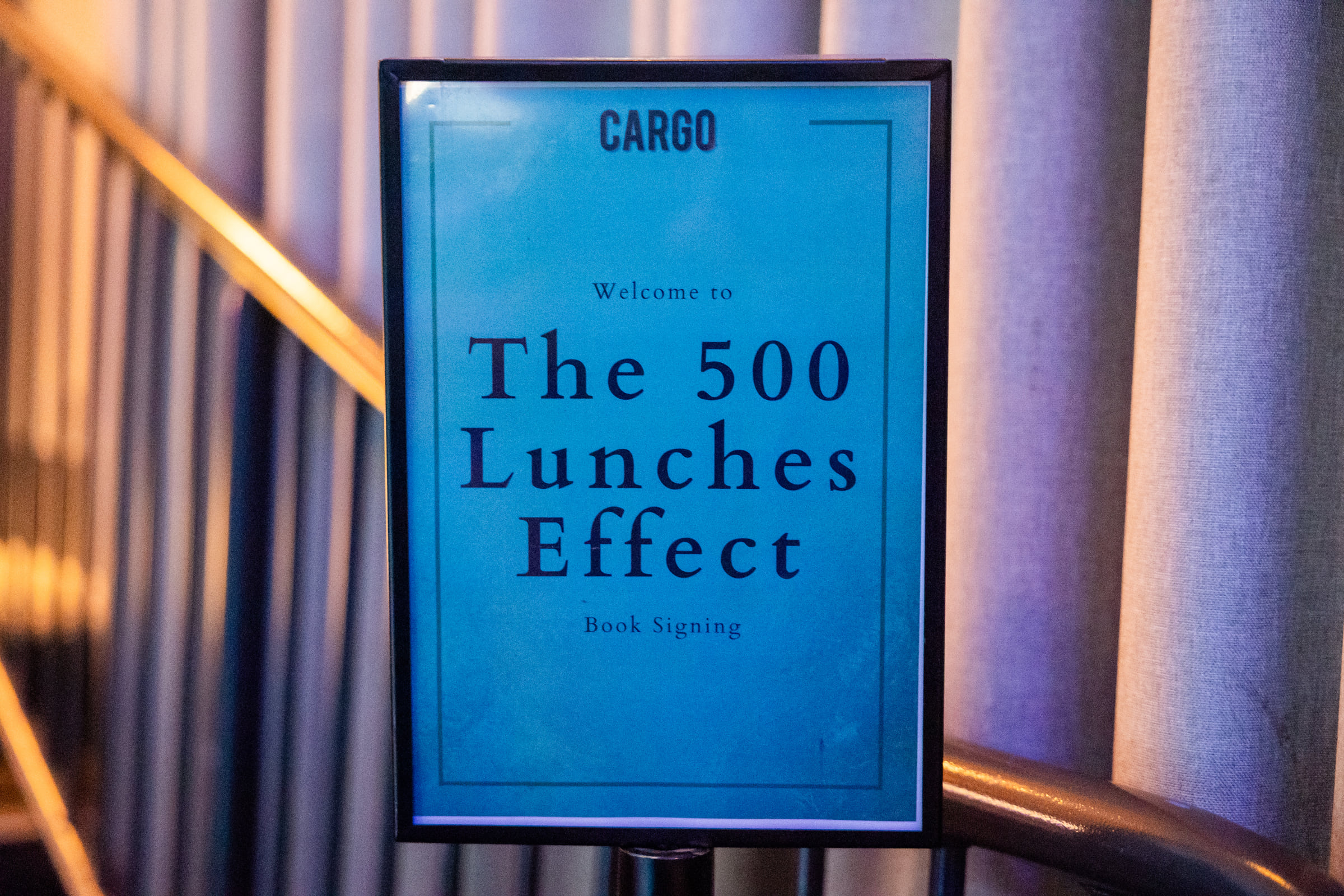 The 500 Lunches Effect welcome sign at Cargo Bar
